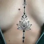 a tattoo on a woman's chest