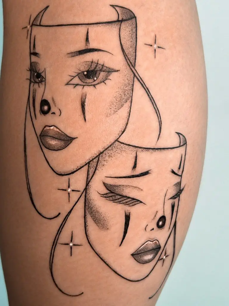 a tattoo of two women with masks on the side of her body